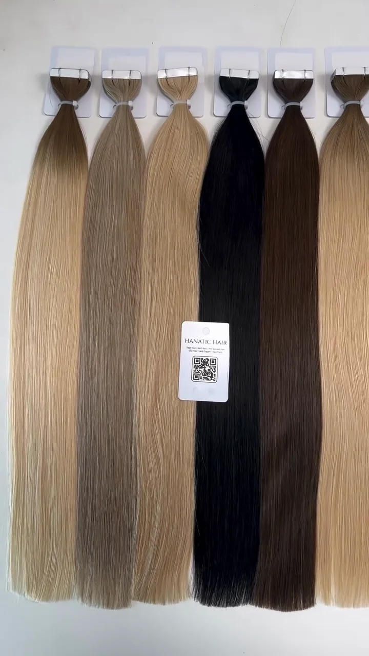 Tape-in hair bundles arranged in blonde, brown and dark shades
